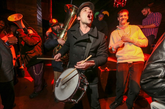 Baltimore, Md — February 14, 2015 — Patrick Meyer, 30, of the brass band Stumblebum, marches into Mosaic during the Mardi Gras celebration at Power Plant Live this past weekend. (Kaitlin Newman/Baltimore Sun)